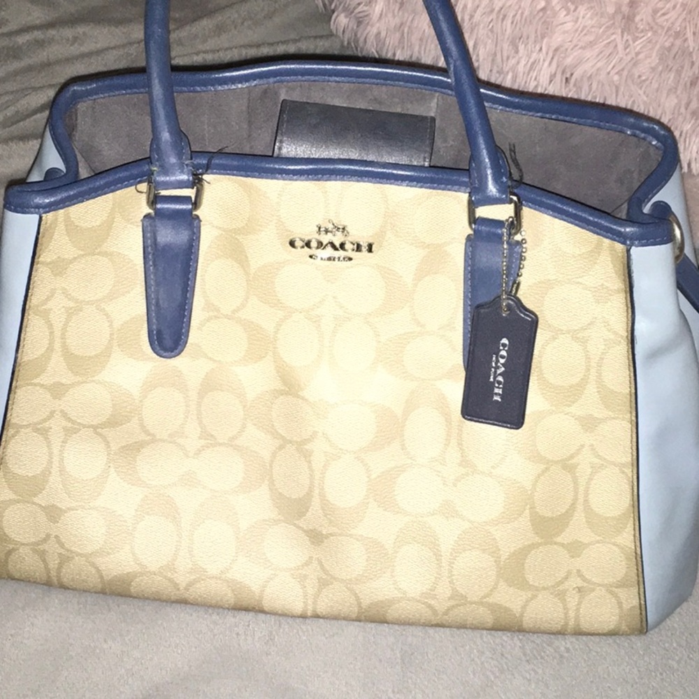 Coach Blue and Cream Satchel with Structured Design. significant damage to strap